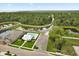 An aerial view of a community pool near a walking trail and lakes surrounded by a lush Florida landscape at 3635 Arbordale Loop, Sanford, FL 32771