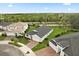 Aerial view showing home's location with nearby green spaces and neighboring houses in a residential area at 3635 Arbordale Loop, Sanford, FL 32771