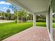 Expansive backyard with lush green lawn and a covered patio, ideal for outdoor entertaining at 3635 Arbordale Loop, Sanford, FL 32771