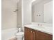 Bathroom with a walk-in shower, white vanity, and neutral-toned walls at 3635 Arbordale Loop, Sanford, FL 32771