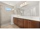 Modern bathroom featuring double vanity with dark wood cabinets and a glass enclosed shower at 3635 Arbordale Loop, Sanford, FL 32771