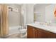 Bathroom featuring a combined bathtub and shower, vanity, and tile backsplash at 3635 Arbordale Loop, Sanford, FL 32771