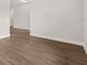 Clean empty bedroom showcases wood-look flooring and ample natural light at 3635 Arbordale Loop, Sanford, FL 32771
