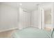 Bedroom featuring carpeted floor, a large closet, and a door to the bathroom at 3635 Arbordale Loop, Sanford, FL 32771