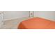 Bedroom corner with an orange bed, neutral carpet, and a closet entrance at 3635 Arbordale Loop, Sanford, FL 32771