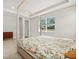 A spacious bedroom with a four poster bed and windows that provide ample natural light at 3635 Arbordale Loop, Sanford, FL 32771