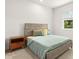 Bedroom with a large window and a rustic wooden bed, and green bedding at 3635 Arbordale Loop, Sanford, FL 32771