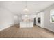 Spacious kitchen with a large island, stainless steel appliances, and modern white cabinetry at 3635 Arbordale Loop, Sanford, FL 32771