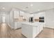 Well-appointed kitchen with a central island and modern appliances for an efficient cooking space at 3635 Arbordale Loop, Sanford, FL 32771