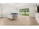 Sunlit living room boasts sliding glass doors to backyard, flooding space with natural light at 3635 Arbordale Loop, Sanford, FL 32771