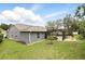The fenced backyard features a screened pool area and lawn, offering an ideal outdoor retreat at 394 Hickory Springs Pl, Debary, FL 32713