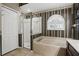 Bathroom showcasing a garden tub, step in shower, and window with shutter at 394 Hickory Springs Pl, Debary, FL 32713