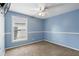 Bedroom with carpet flooring, fan, and natural light from the window at 394 Hickory Springs Pl, Debary, FL 32713