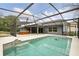 A gorgeous screened-in pool with a hot tub and backyard view, perfect for outdoor living at 394 Hickory Springs Pl, Debary, FL 32713