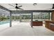 Enclosed patio area with an in-ground hot tub, outdoor bar, and ceiling fans at 394 Hickory Springs Pl, Debary, FL 32713