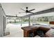 Enclosed patio with an in-ground pool, hot tub, and an outdoor bar at 394 Hickory Springs Pl, Debary, FL 32713