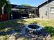 Large backyard with firepit and screened-in pool, great for outdoor gatherings at 415 Seville Ave, Altamonte Springs, FL 32714