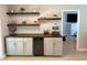 Stylish bar area with floating shelves, a wine cooler, and modern cabinetry at 415 Seville Ave, Altamonte Springs, FL 32714