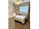 Bedroom with neutral walls, a dresser, and a cozy bed with a window at 415 Seville Ave, Altamonte Springs, FL 32714