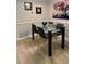 Contemporary dining area featuring a glass-top table with modern seating and decor to create a stylish and inviting space at 415 Seville Ave, Altamonte Springs, FL 32714