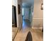 Inviting hallway featuring wood flooring, neutral walls, and direct access to the home's entrance at 415 Seville Ave, Altamonte Springs, FL 32714