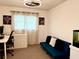 Cozy home office featuring a sleek desk, futon couch, and bright decor at 415 Seville Ave, Altamonte Springs, FL 32714