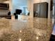 Modern kitchen showcasing granite countertops, stainless appliances, white cabinets, and an open design at 415 Seville Ave, Altamonte Springs, FL 32714