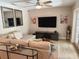 Inviting living room with modern decor, comfortable seating, and a large screen TV for entertainment at 415 Seville Ave, Altamonte Springs, FL 32714