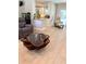 Cozy living area with stylish coffee table, granite counter and white cabinets, offering a functional and comfortable living space at 415 Seville Ave, Altamonte Springs, FL 32714