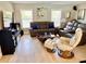 Comfortable living room with plush sofas, ample seating, and lots of natural light from the windows at 415 Seville Ave, Altamonte Springs, FL 32714
