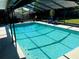 Relaxing screened-in pool area featuring clear blue water and comfortable seating for outdoor enjoyment at 415 Seville Ave, Altamonte Springs, FL 32714