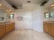 Spacious bathroom with dual vanities, neutral paint and tile floors at 4906 Keaton Crest Dr, Orlando, FL 32837
