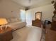 Cozy bedroom featuring a daybed, dresser with mirror, and neutral carpet at 4906 Keaton Crest Dr, Orlando, FL 32837
