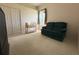 Bedroom featuring a crib and green love seat, carpet flooring and big closet at 4906 Keaton Crest Dr, Orlando, FL 32837