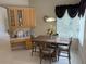 Bright dining area featuring ample natural light, table with four chairs, and a built in buffet at 4906 Keaton Crest Dr, Orlando, FL 32837