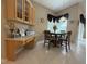 Bright dining area includes a built-in desk, dining table, and ample natural light creating an inviting atmosphere at 4906 Keaton Crest Dr, Orlando, FL 32837