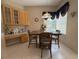 A cozy dining area features a charming window, wooden table, and built-in hutch for a welcoming space at 4906 Keaton Crest Dr, Orlando, FL 32837