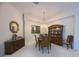 Elegant dining room featuring classic furniture, chandelier and room for entertaining guests at 4906 Keaton Crest Dr, Orlando, FL 32837