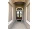 Welcoming entryway with a decorative tiled floor leading to a beautiful glass-paneled front door at 4906 Keaton Crest Dr, Orlando, FL 32837