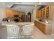 Bright kitchen boasts stainless steel appliances and breakfast bar with seating for a modern lifestyle at 4906 Keaton Crest Dr, Orlando, FL 32837