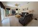 Comfortable living room with large leather sofa, ceiling fan and decor at 4906 Keaton Crest Dr, Orlando, FL 32837