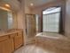 Elegant bathroom featuring a garden tub and a separate shower cabin at 4906 Keaton Crest Dr, Orlando, FL 32837