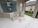 Cozy screened-in patio featuring comfortable seating for outdoor relaxation at 4906 Keaton Crest Dr, Orlando, FL 32837