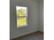 Bright bedroom with a view of the lush outdoor landscape at 5153 Sw 159Th St, Ocala, FL 34473