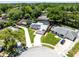 Charming single-Gathering home featuring solar panels, a screened-in pool, and a well-manicured lawn in a quiet neighborhood at 525 Southport Dr, Longwood, FL 32750
