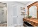 Stylishly renovated bathroom featuring a glass-enclosed shower and decorative vanity at 525 Southport Dr, Longwood, FL 32750