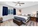 Relaxing bedroom with ensuite bathroom, ceiling fan and a window view at 525 Southport Dr, Longwood, FL 32750