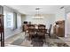 Comfortable dining room with wood flooring and an abundance of natural light at 525 Southport Dr, Longwood, FL 32750