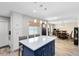 Modern kitchen with center island, granite counters, and stainless steel appliances at 525 Southport Dr, Longwood, FL 32750