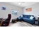 Casual living room featuring sectional couch, natural light and art decor at 525 Southport Dr, Longwood, FL 32750